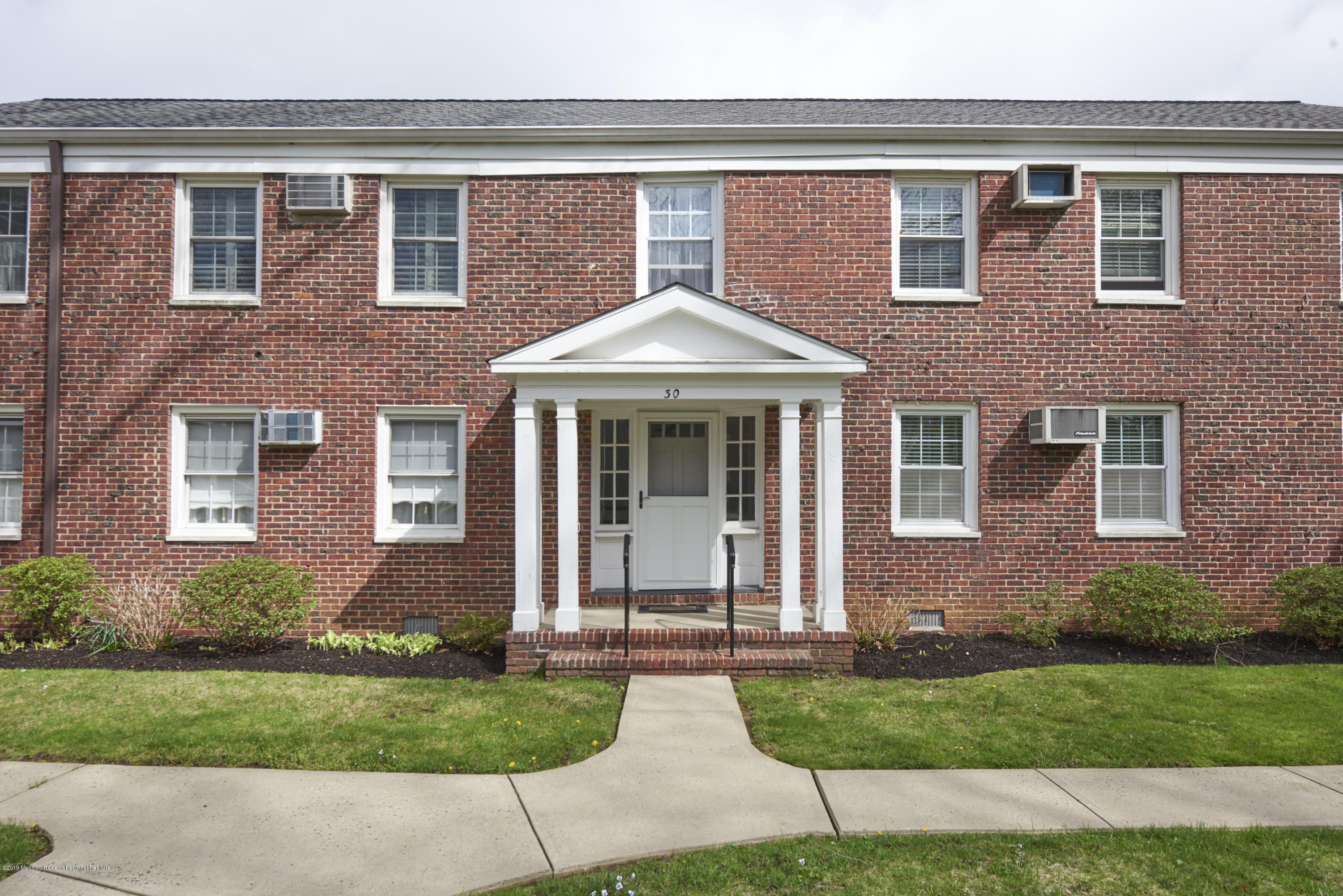 30 Pinckney Road, Unit C Red Bank, NJ 07701 - Photo 15 of 18 front view of a house with a yard