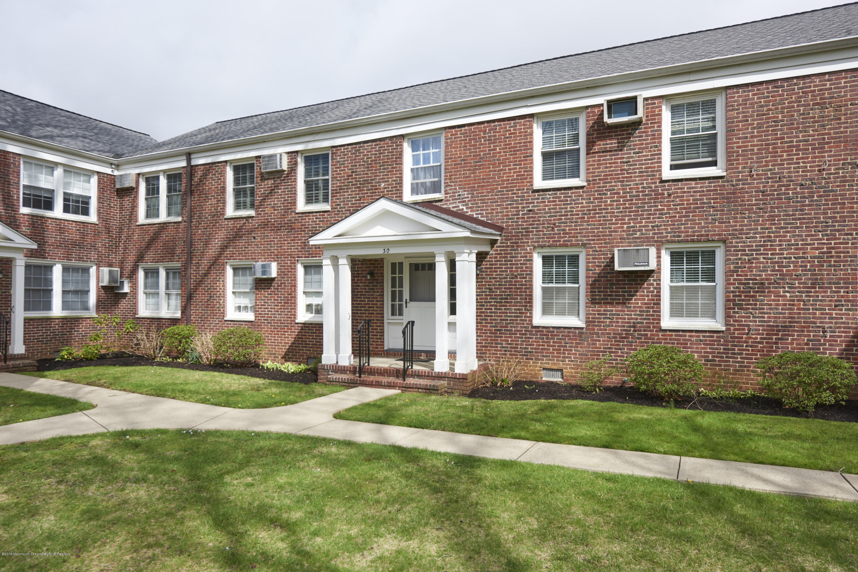 30 Pinckney Road, Unit C Red Bank, NJ 07701 - Photo 16 of 18 a front view of a house with a yard