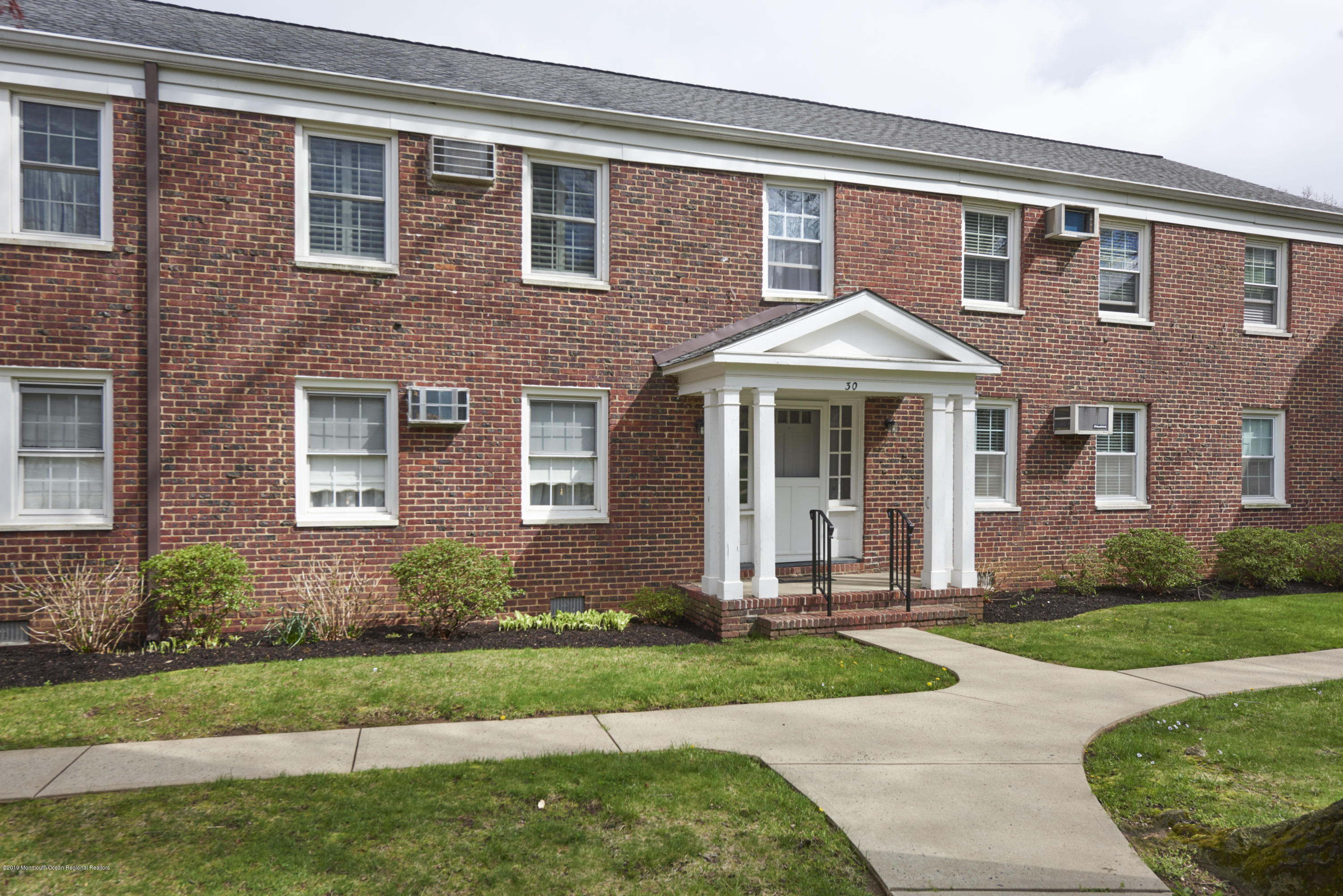30 Pinckney Road, Unit C Red Bank, NJ 07701 - Photo 17 of 18 a front view of a house with yard and green space