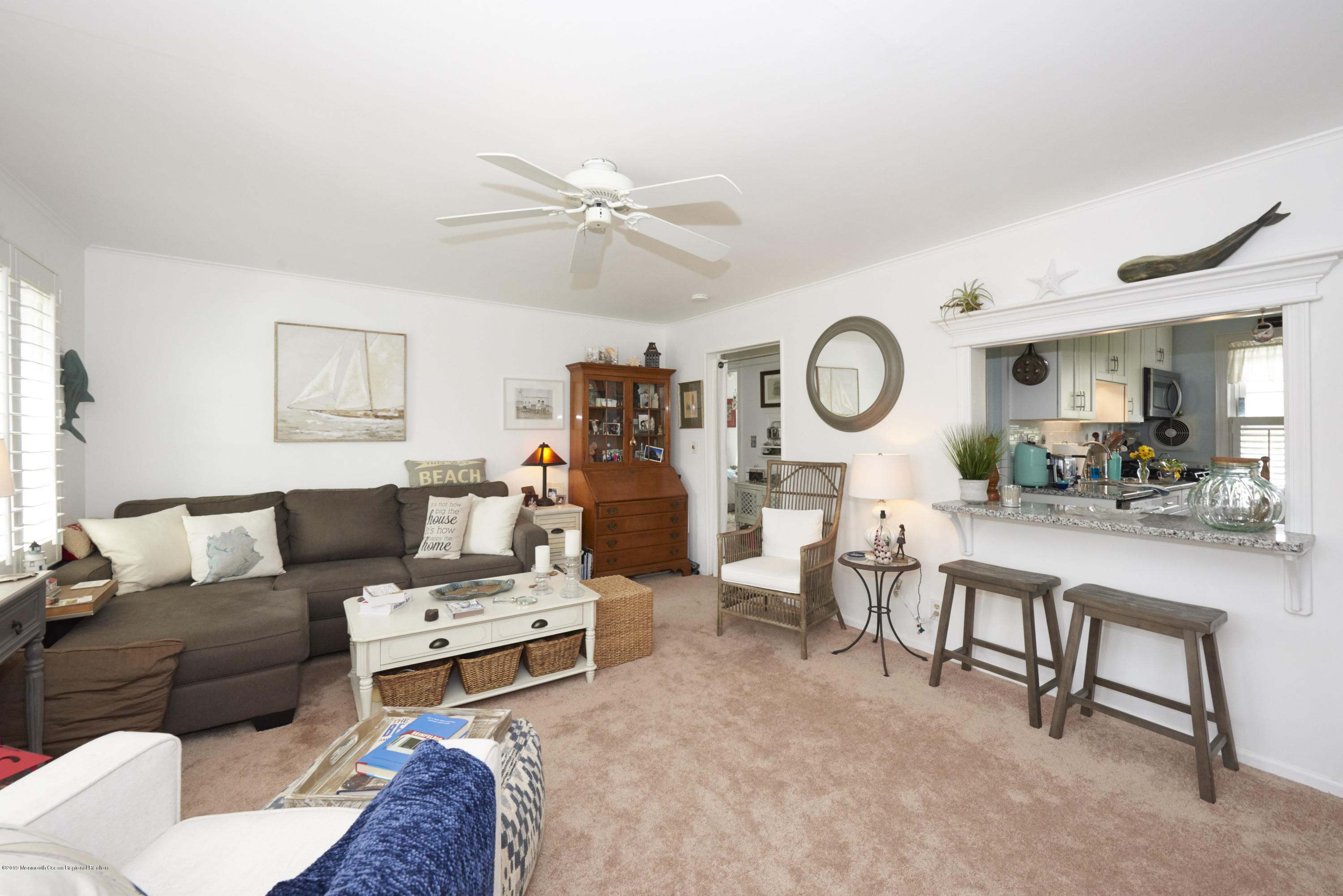 30 Pinckney Road, Unit C Red Bank, NJ 07701 - Photo 6 of 18 a living room with furniture a rug and a clock