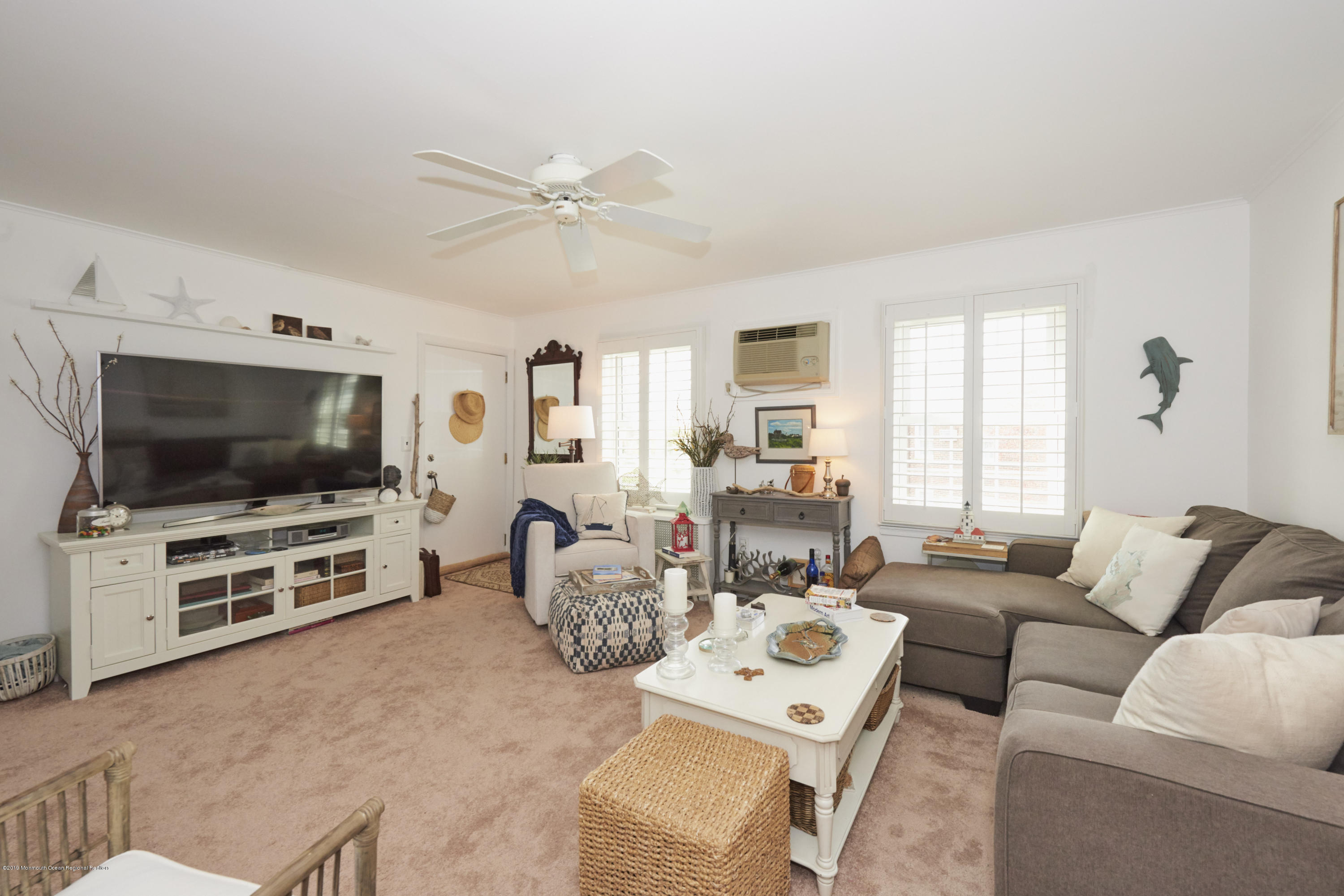 30 Pinckney Road, Unit C Red Bank, NJ 07701 - Photo 7 of 18 a living room with furniture and a flat screen tv