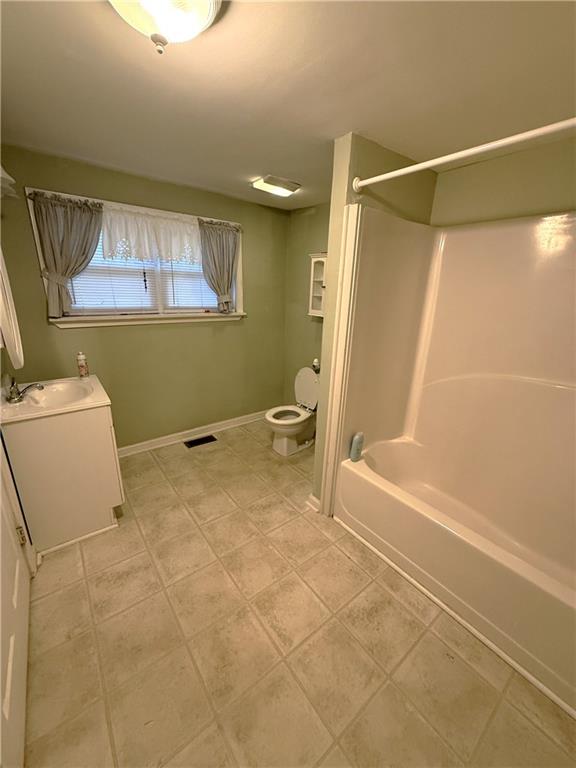 1740 Spring Street Northeast Conyers, GA 30012 - Photo 17 of 23 a bathroom with a bathtub and a shower