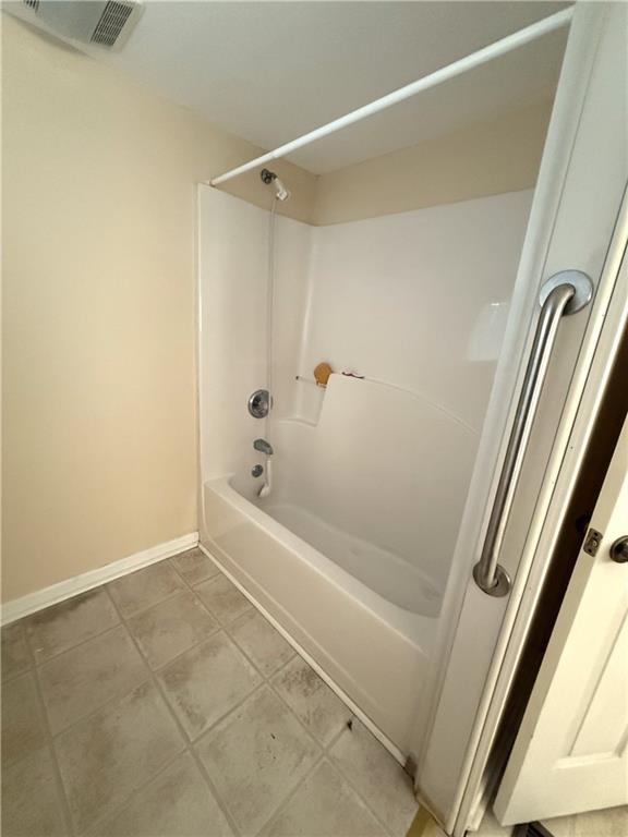 1740 Spring Street Northeast Conyers, GA 30012 - Photo 18 of 23 a bathroom with a tub and shower