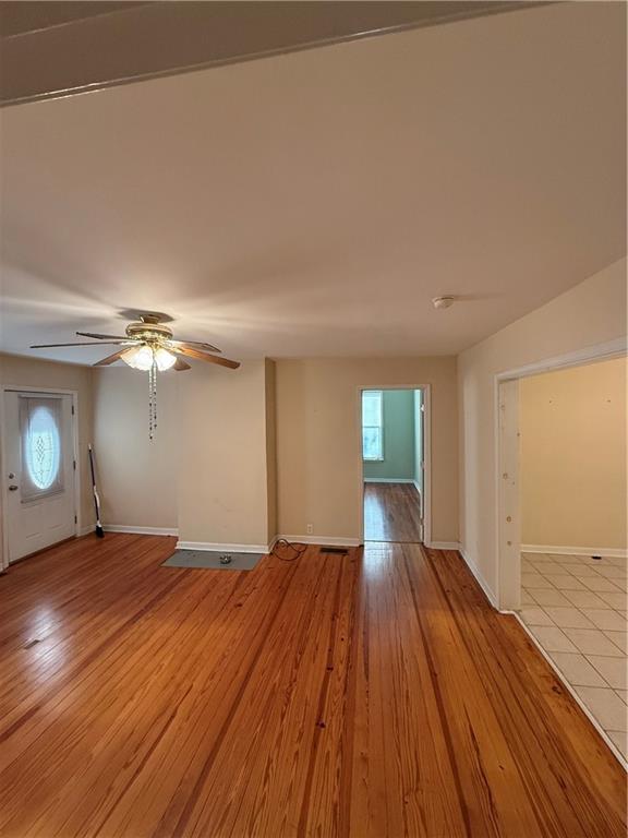 1740 Spring Street Northeast Conyers, GA 30012 - Photo 4 of 23 a view of empty room with wooden floor