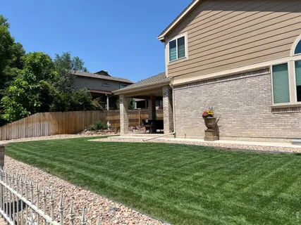 a front view of a house with a garden and patio