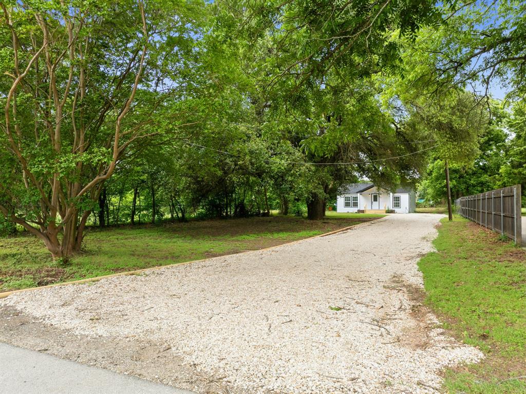 3313 South 3rd Street Waco, TX 76706 - Photo 25 of 28 a view of dirt yard with a large trees