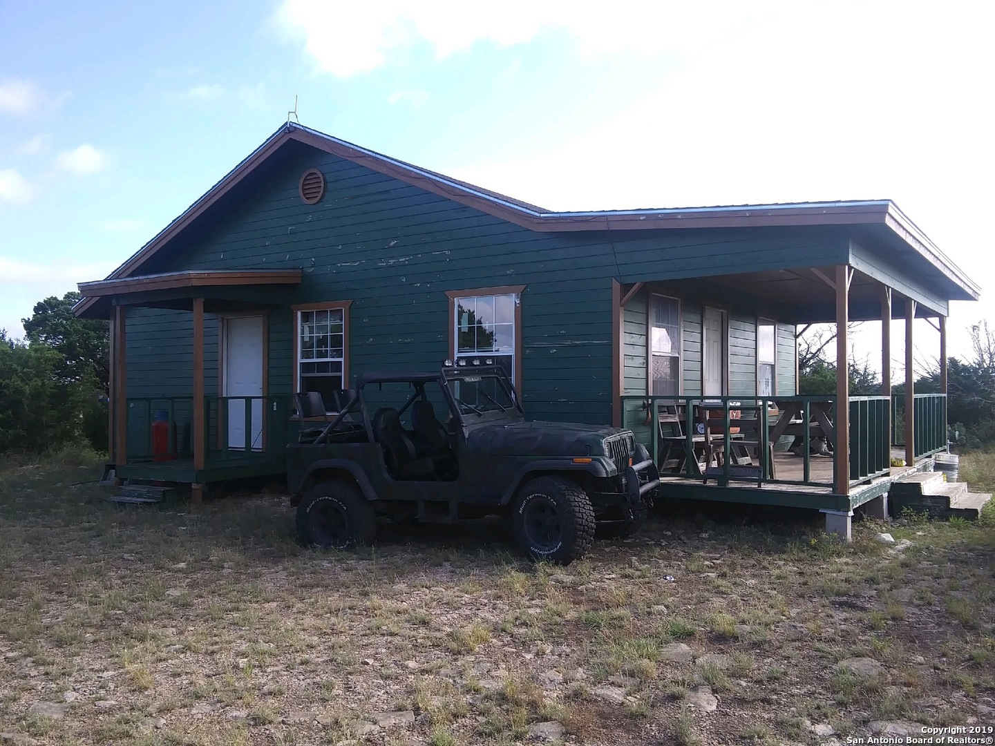 1052 Steep Road Del Rio, TX 78840 - Photo 3 of 25 a view of a house with sitting area and furniture