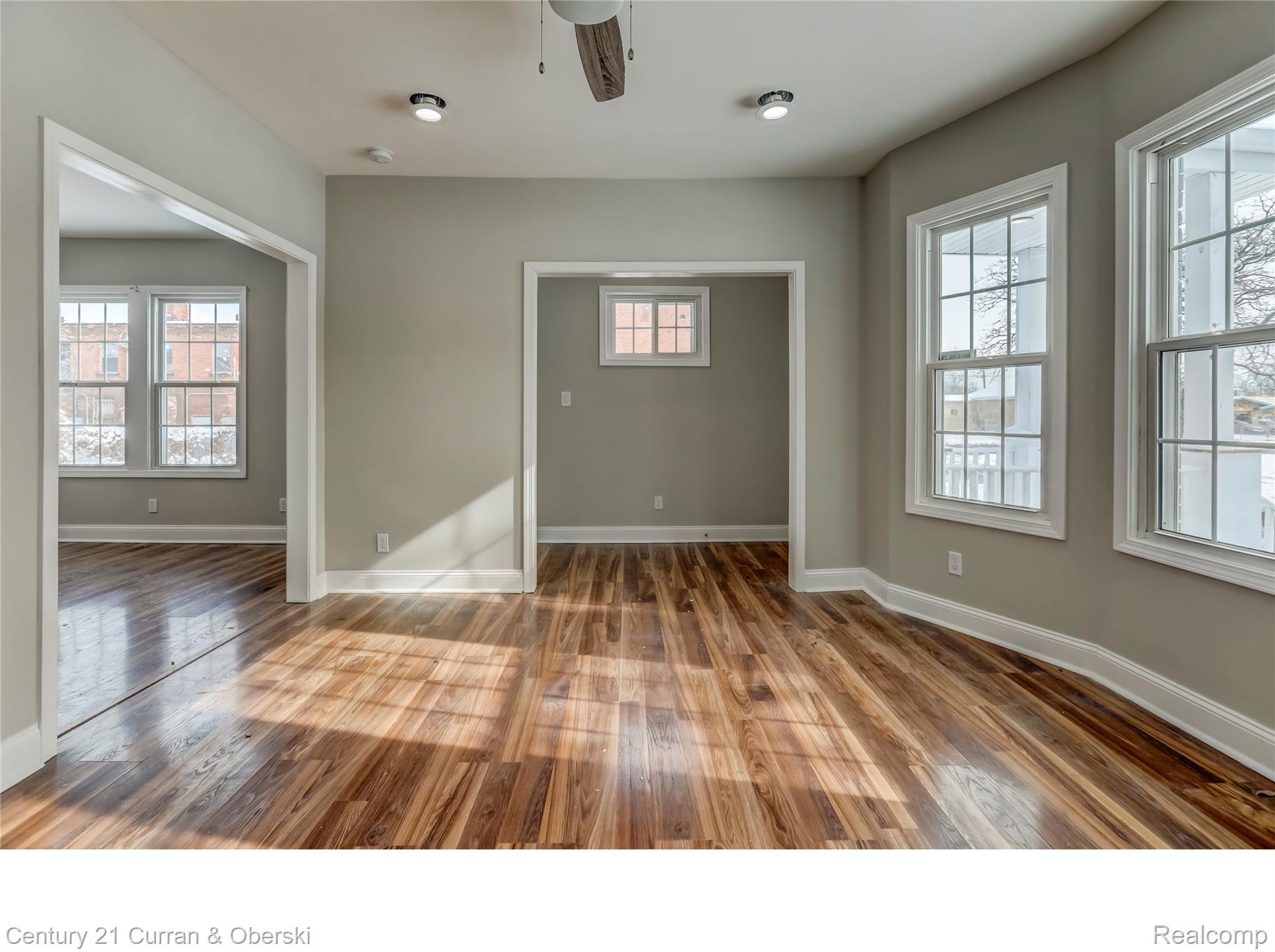 641 Josephine Street Detroit, MI 48202 - Photo 2 of 11 Spacious interior room featuring wood-finish flooring, light gray wall paint, and white trim