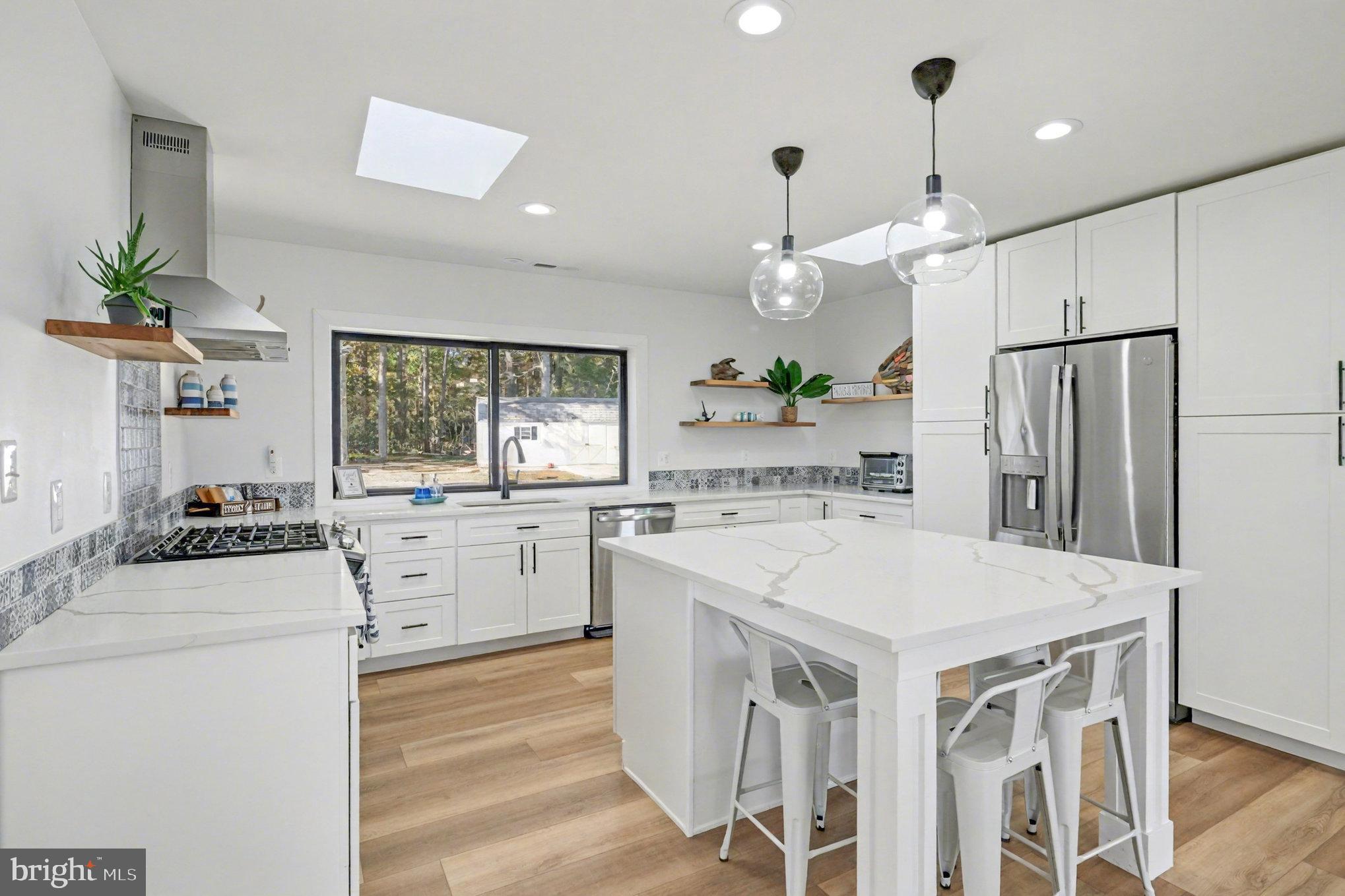 160 Shipwatch Lane Reedville, VA 22539 - Photo 13 of 54 Bright kitchen with quartz countertops