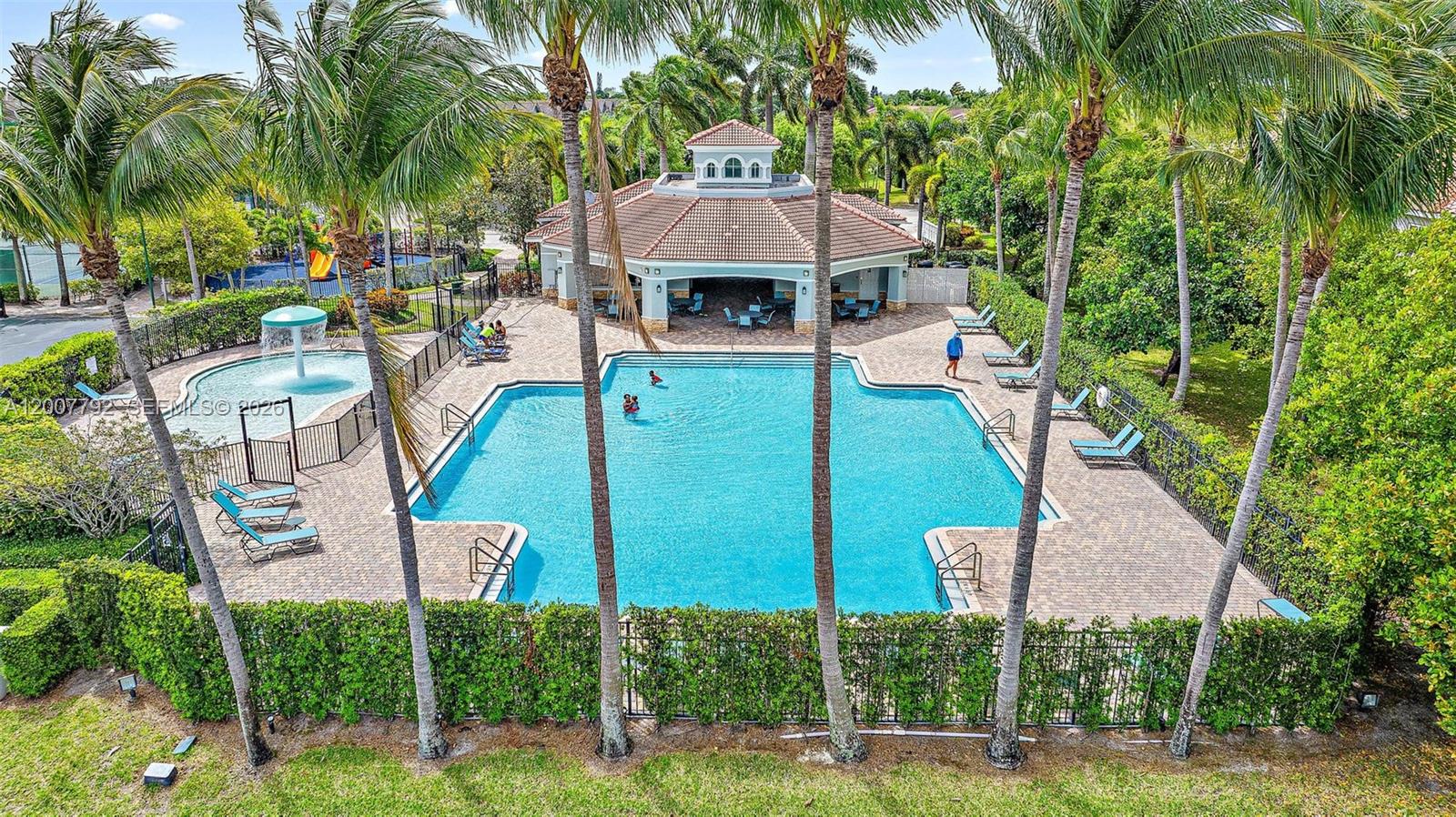 3229 Laurel Ridge Circle, Unit 3229 Riviera Beach, FL 33404 - Photo 15 of 24 a front view of a house with garden