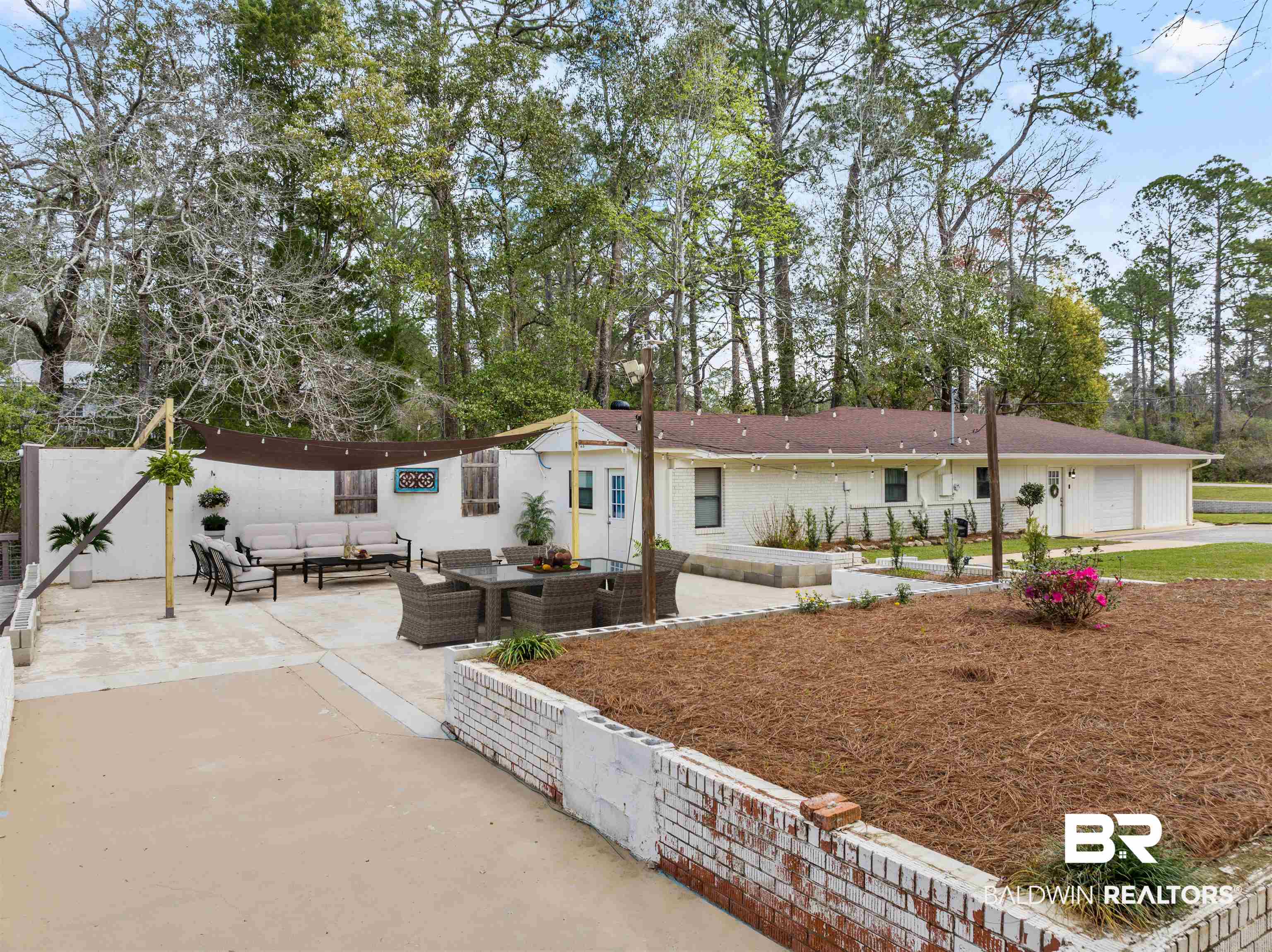 17595 River Road Summerdale, AL 36580 - Photo 23 of 29 View of front of home featuring an outdoor living space, a patio area, and view of wooded area