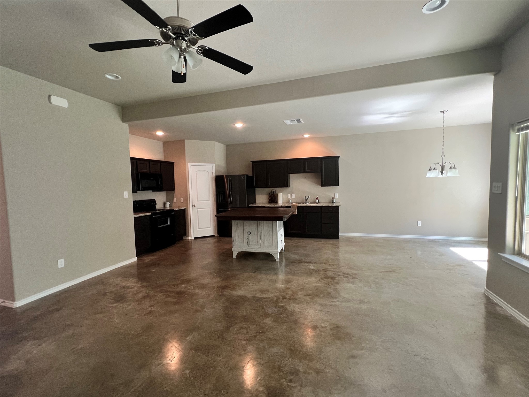 15887 Pecan Drive Montgomery, TX 77356 - Photo 3 of 11 a view of kitchen with a sink and a stove top oven