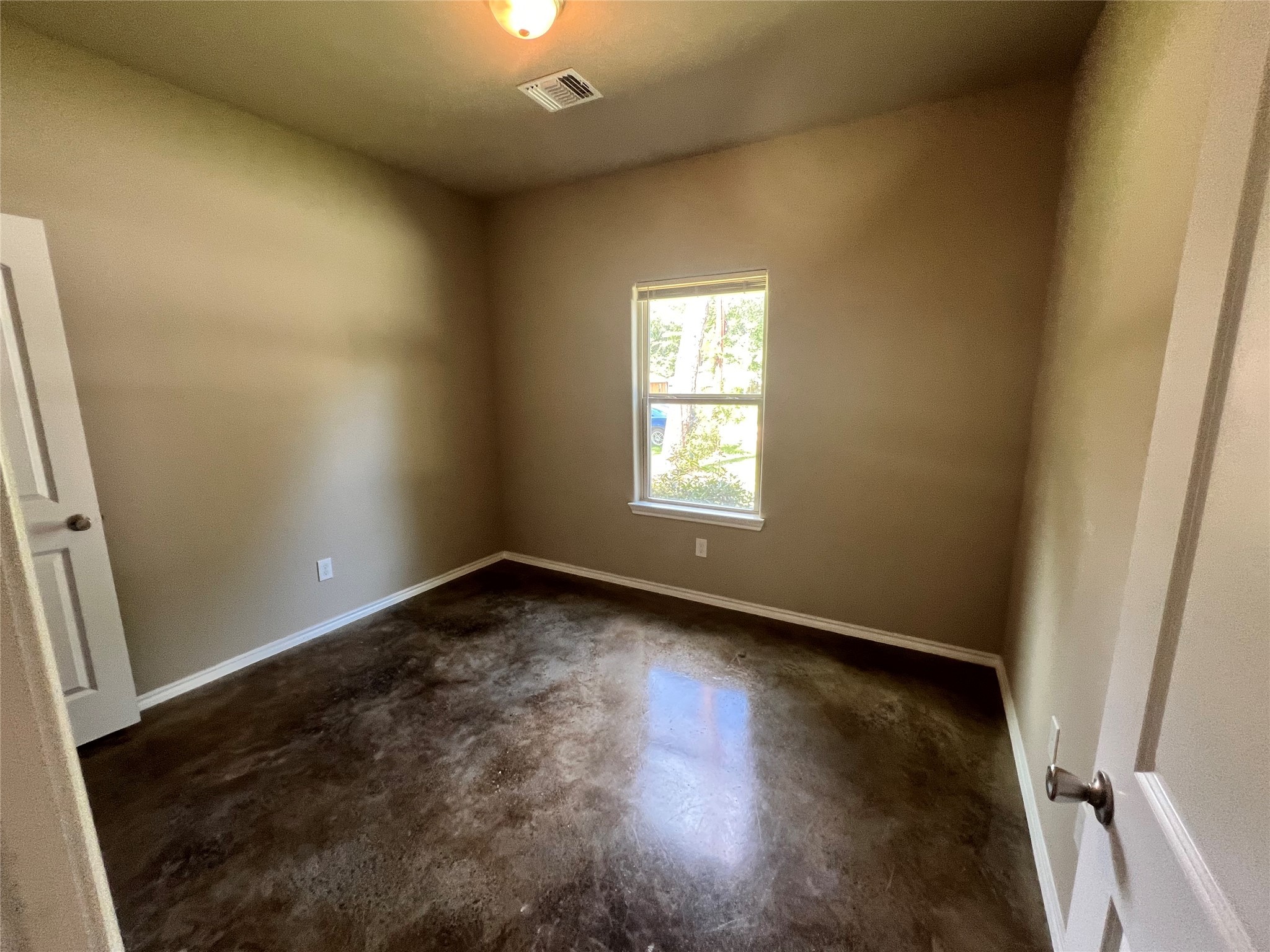 15887 Pecan Drive Montgomery, TX 77356 - Photo 5 of 11 an empty room with wooden floor and windows