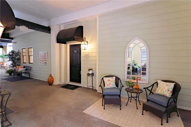 a view of a livingroom with furniture and windows