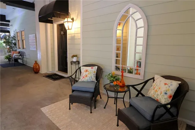 a front view of a house with flowers