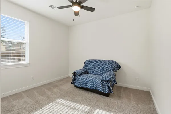 a living room with furniture and a window