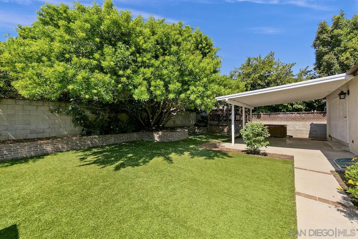 2602 Murray Ridge Road San Diego, CA 92123 - Photo 13 of 17 a view of backyard with a table and chairs and potted plants