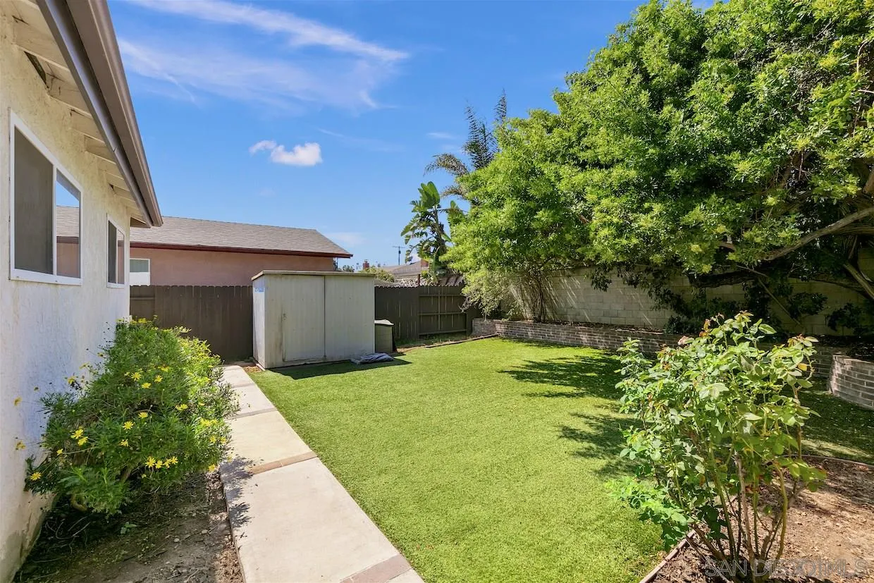 2602 Murray Ridge Road San Diego, CA 92123 - Photo 14 of 17 a yellow and red house with a yard