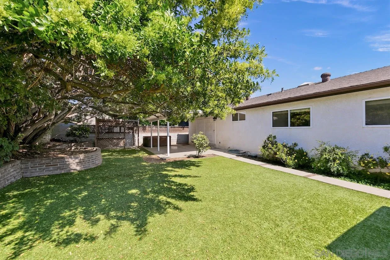 2602 Murray Ridge Road San Diego, CA 92123 - Photo 15 of 17 a backyard of a house with garden and plants