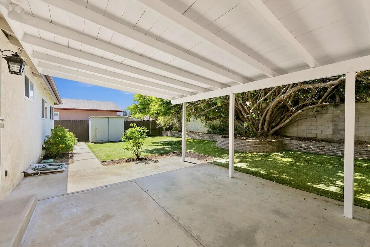 2602 Murray Ridge Road San Diego, CA 92123 - Photo 17 of 17 a view of a house with porch and garden