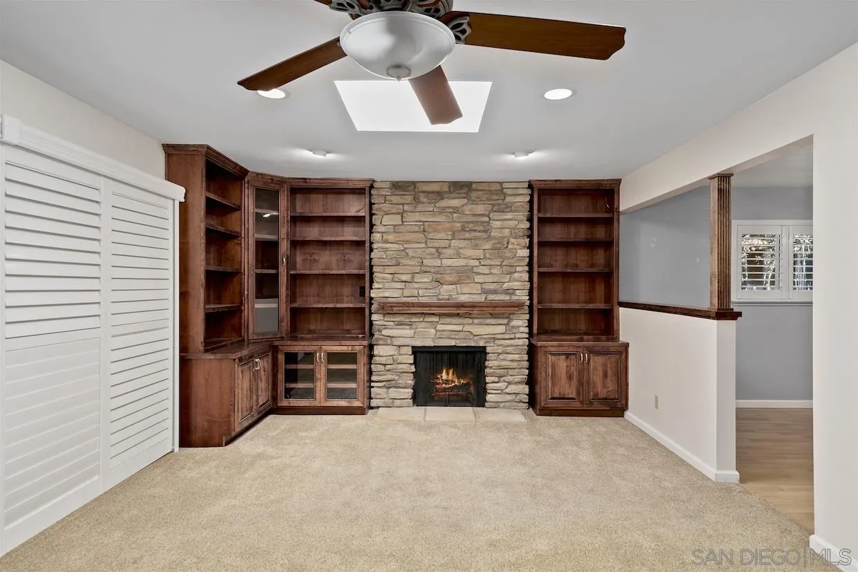 2602 Murray Ridge Road San Diego, CA 92123 - Photo 4 of 17 a view of empty room with a fireplace and cabinet