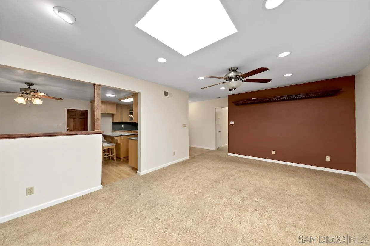 2602 Murray Ridge Road San Diego, CA 92123 - Photo 6 of 17 a view of an empty room with kitchen and a window