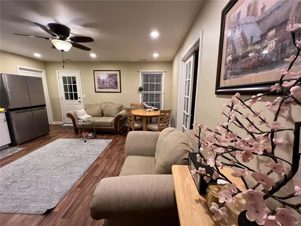 a kitchen with stainless steel appliances granite countertop a refrigerator a stove a sink and a microwave