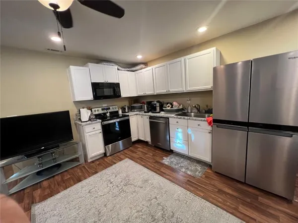 a bedroom with furniture and a window