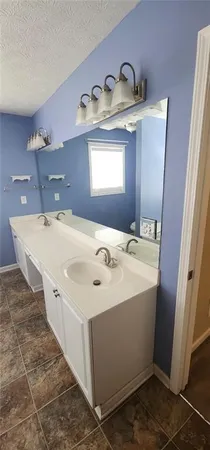 a bathroom with a tub and a window