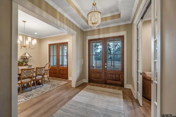 a view of a livingroom with furniture window and wooden floor
