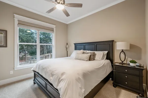 a view of a house with a big yard and large trees