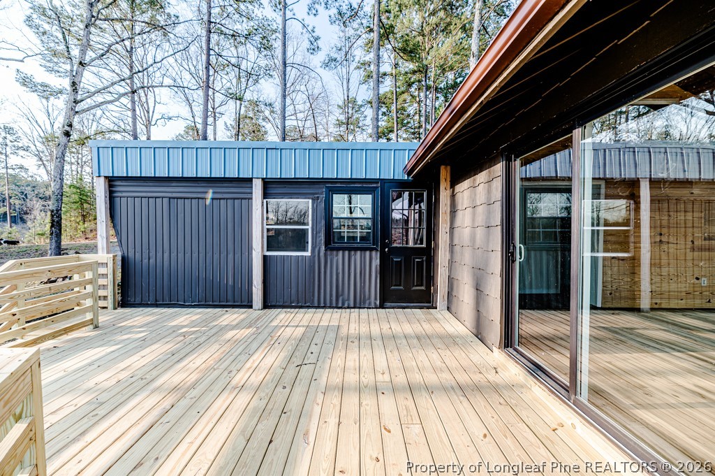161 White Oak Street Carthage, NC 28327 - Photo 19 of 29 a view of backyard with large trees and wooden fence