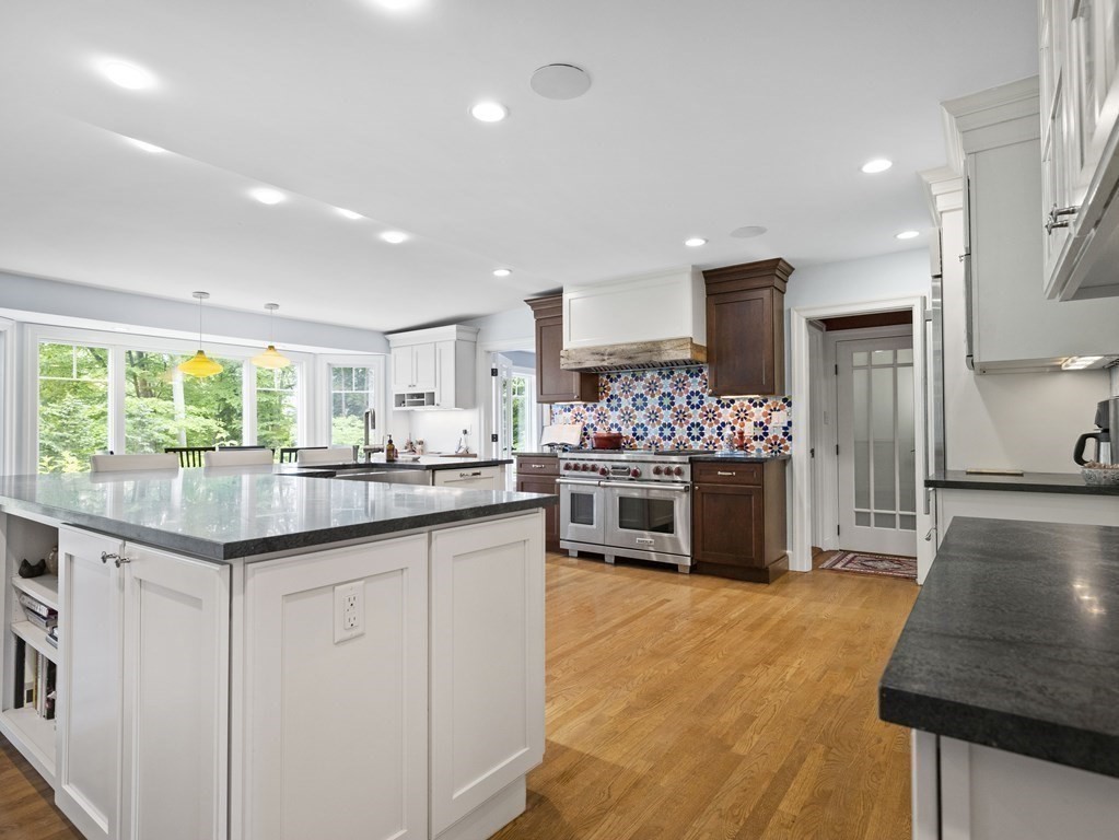 60 Damien Road Wellesley, MA 02481 - Photo 3 of 36 a kitchen with stainless steel appliances kitchen island granite countertop a stove and cabinets