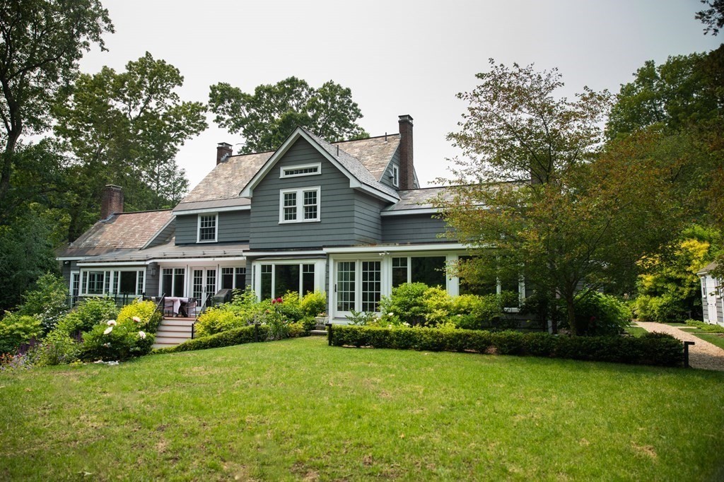 60 Damien Road Wellesley, MA 02481 - Photo 31 of 36 a front view of a house with a yard and trees
