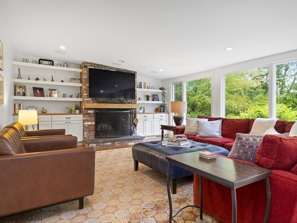 60 Damien Road Wellesley, MA 02481 - Photo 6 of 36 a living room with furniture a flat screen tv and a fireplace