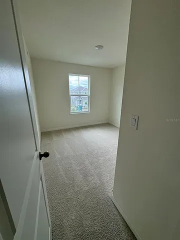 a view of hallway with a window