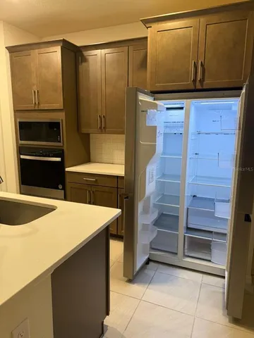 a kitchen with a sink and an oven