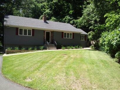 4 Caputo Road North Branford, CT 06471 - Photo 1 of 1 a front view of a house with yard and trees
