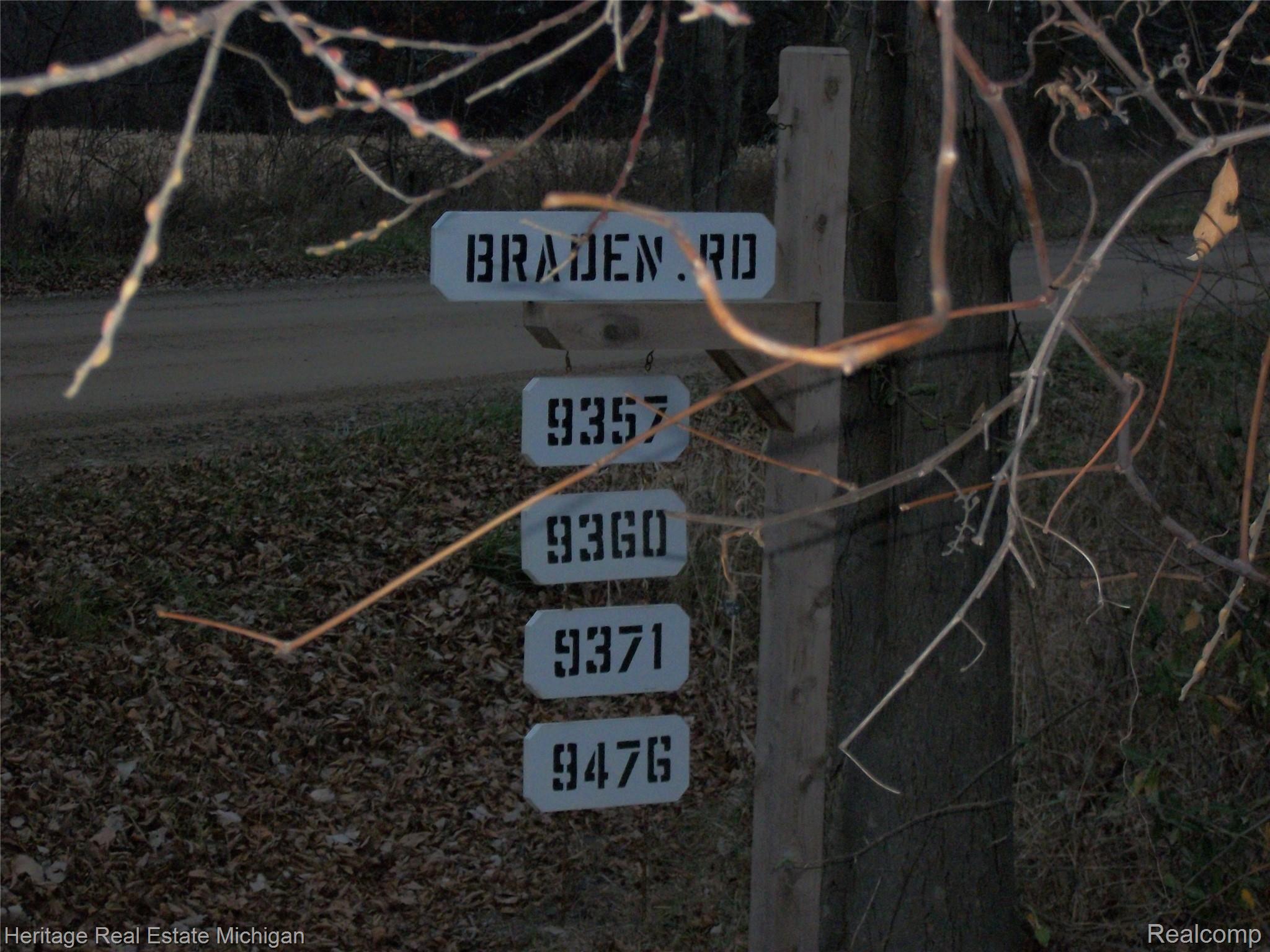 9371 Braden Road Byron, MI 48418 - Photo 4 of 13 Street sign at the corner of Barnes