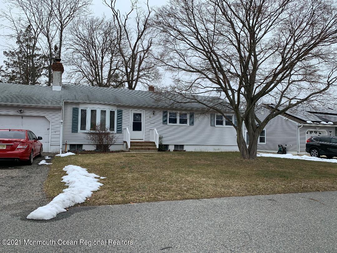 3 Midpark Drive Brick, NJ 08724 - Photo 2 of 12 a view of a house with a yard covered in snow
