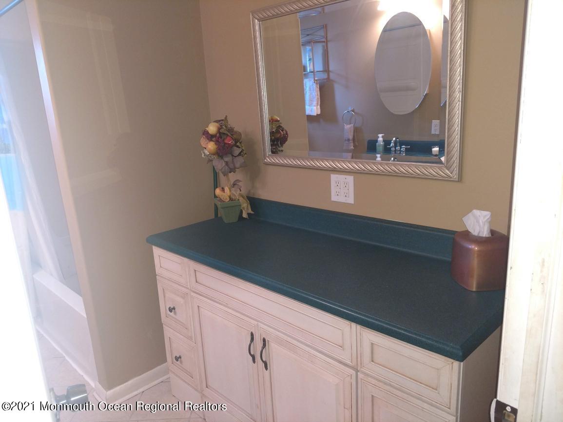 3 Midpark Drive Brick, NJ 08724 - Photo 11 of 12 a bathroom with a sink and a mirror