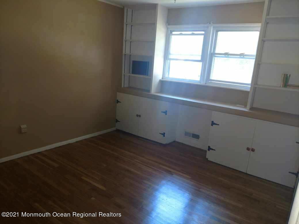 3 Midpark Drive Brick, NJ 08724 - Photo 5 of 12 an empty room with wooden floor and windows