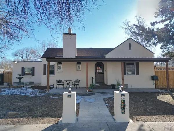 a front view of a house with garage