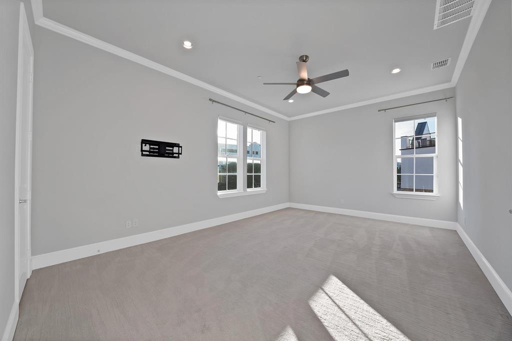 5437 Patterson Street Irving, TX 75039 - Photo 11 of 24 Recessed lighting, ceiling fan, crown molding, double windows, and carpet flooring