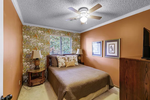 a bedroom with a bed and lamp