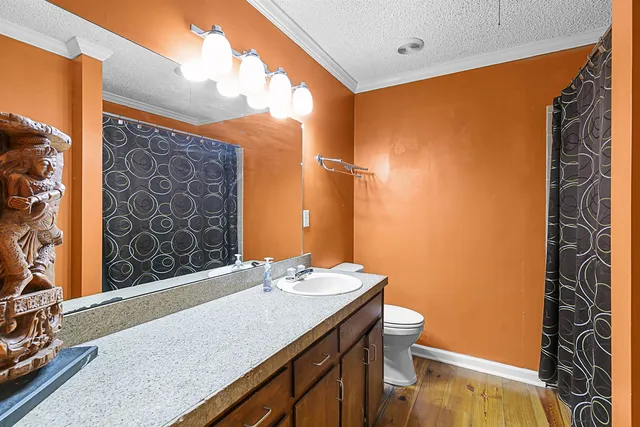 a bedroom with furniture and a large window