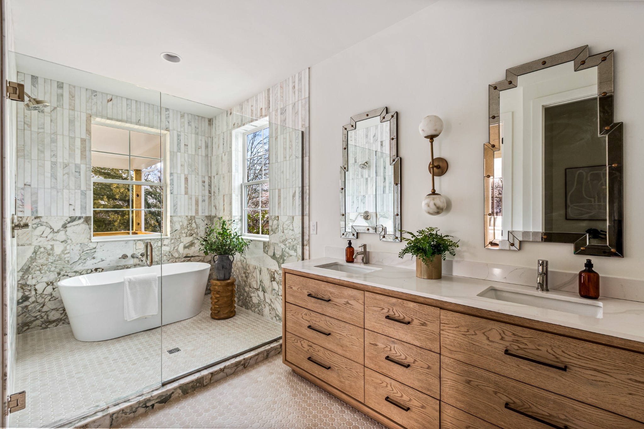 3819 Cross Creek Road Nashville, TN 37215 - Photo 17 of 36 a spacious en suite bathroom with a double vanity sink a large mirror and a bathtub