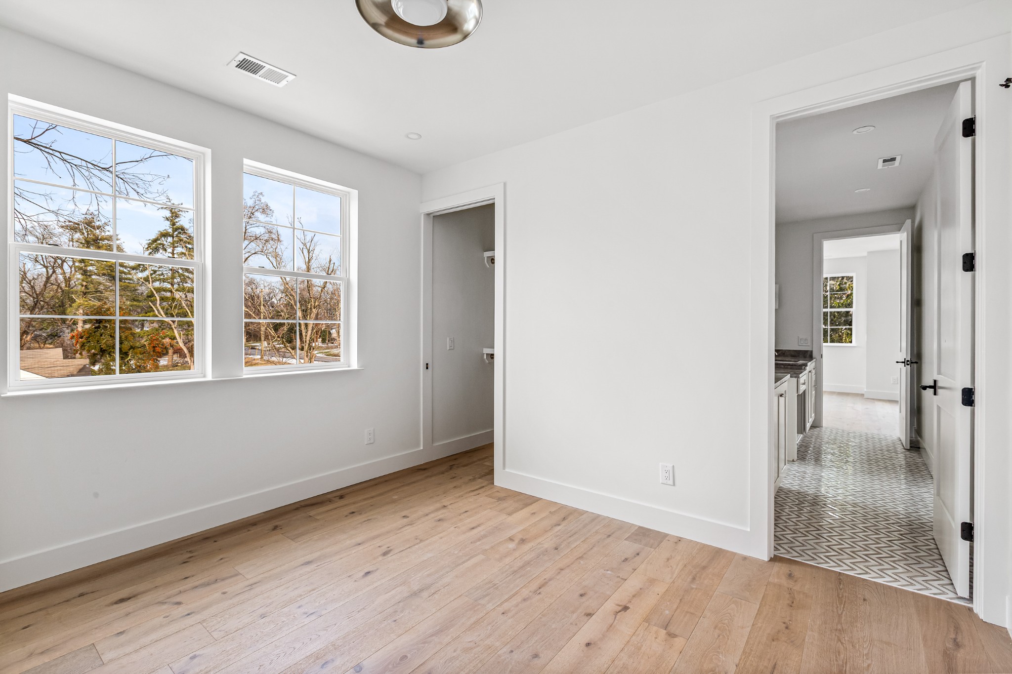 3819 Cross Creek Road Nashville, TN 37215 - Photo 22 of 36 an empty room with wooden floor and windows