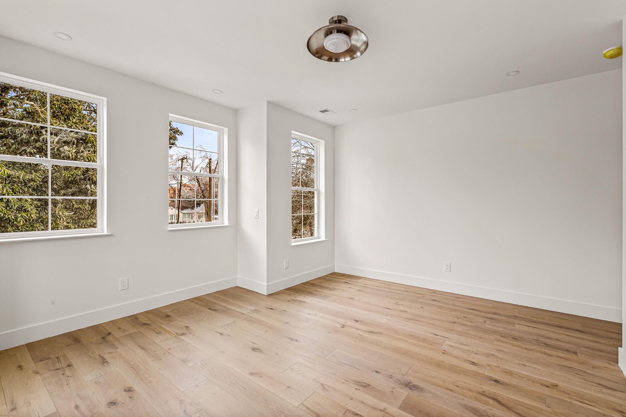 3819 Cross Creek Road Nashville, TN 37215 - Photo 27 of 36 a view of an empty room with a window and wooden floor