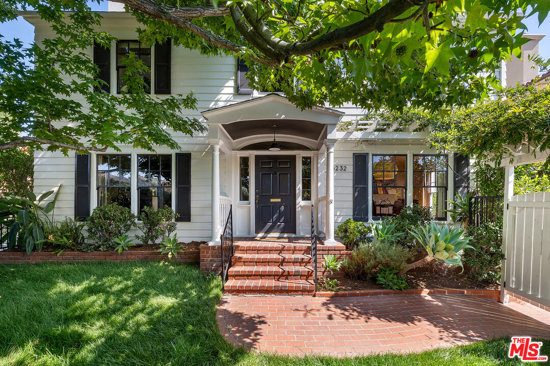 5232 Hartwick Street Los Angeles, CA 90041 - Photo 1 of 25 a front view of a house with a yard